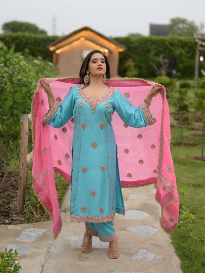 A playful shot showing off the full outfit. The makeup is designed to look great from any angle.