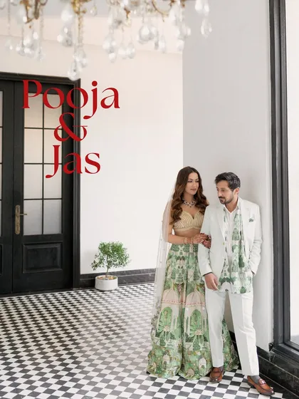 A stylish portrait of the couple, with their names overlaid. The black and white checkered floor and grand doorway add a touch of classic elegance.