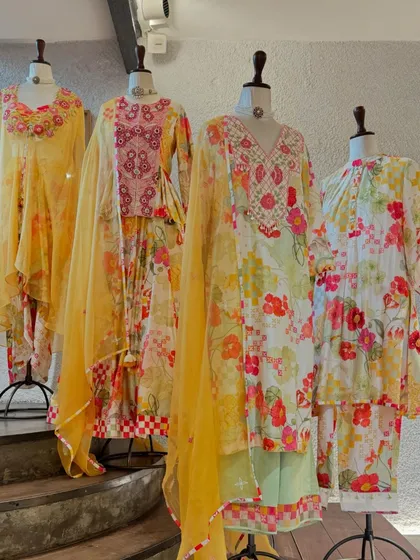 The full collection of these cheerful floral suits, featuring different silhouettes from A-line kurtas to layered capes.