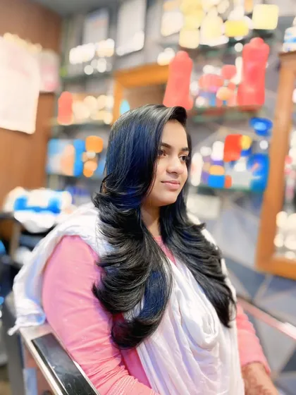 This side profile shows how the layers in this haircut frame the face and add dimension. It's a versatile style that looks great from every angle.