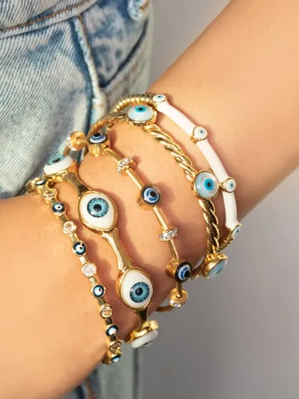 A closer look at how my evil eye bangles look when stacked. I love mixing the different colors and styles for a personalized, protective arm party.