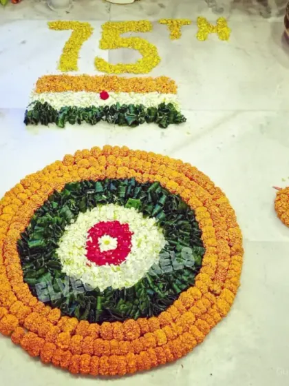 A beautiful and traditional way to celebrate Republic Day. This floor decoration features a floral rangoli of the Indian flag and the Ashoka Chakra, meticulously crafted from marigold and other flower petals.