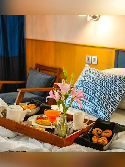 Breakfast in bed, fit for royalty. I believe in pampering my guests with luxurious in-room dining experiences.