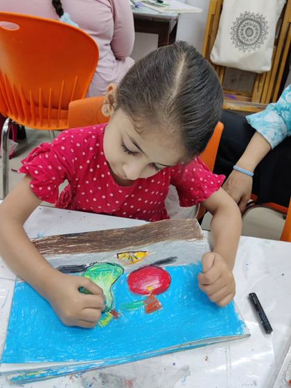 More images of our dedicated young artists at work and proudly displaying their creations.