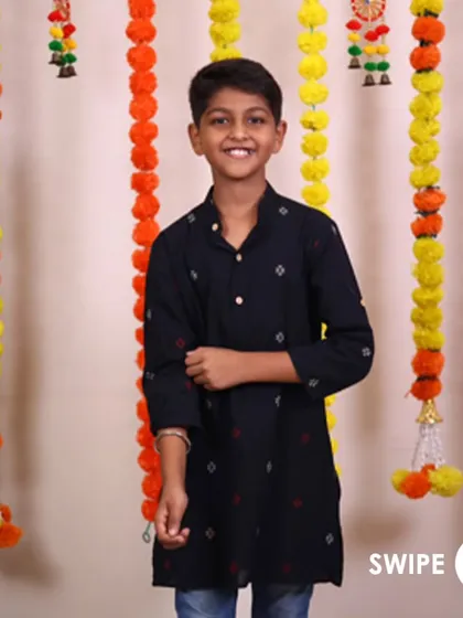A classic black kurta is a must-have. This one is made from comfortable cotton with a subtle print, making it a stylish choice for any festive occasion.