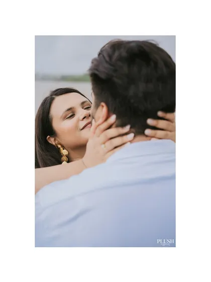 An intimate close-up from a pre-wedding shoot in Goa, capturing a tender moment between the couple.