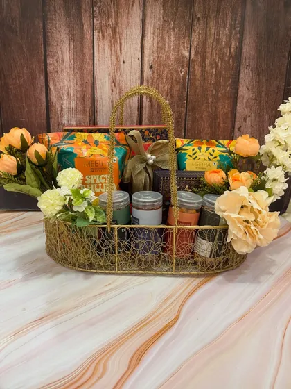 Another look at our boat-shaped snack basket for Rakhi, filled with a variety of gourmet Indian snacks and ready to be gifted.