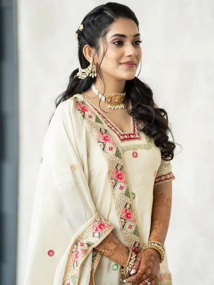 A three-quarter view of Supriya's Mehendi look. The makeup is subtle yet effective, creating a polished and pretty final result.