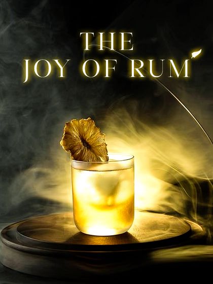 The Joy of Rum. This smoky, pineapple-garnished rum cocktail is a sophisticated take on a classic tropical drink, perfect for those who appreciate a rich, complex flavor.