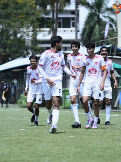Walking back to the center circle with confidence and unity after finding the back of the net.