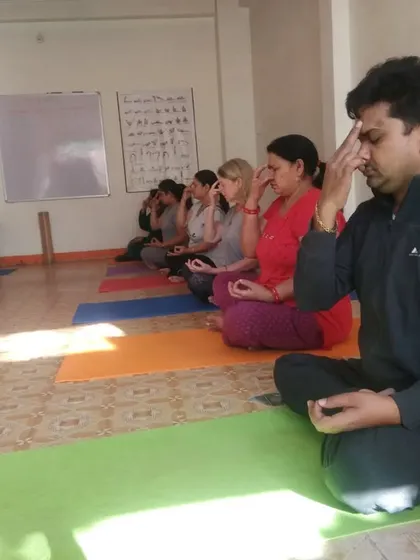 Leading a group class in pranayama, a key part of our practice for stress reduction and mental clarity. I guide students of all levels to connect with their breath in a quiet, focused environment.