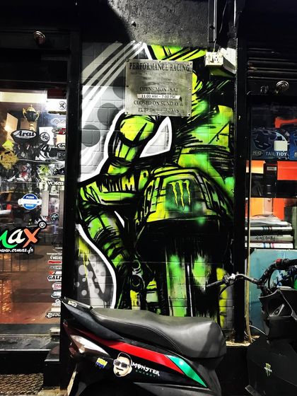 Our mural at night, becoming part of the urban landscape. The art is designed to be durable and impactful in all conditions.