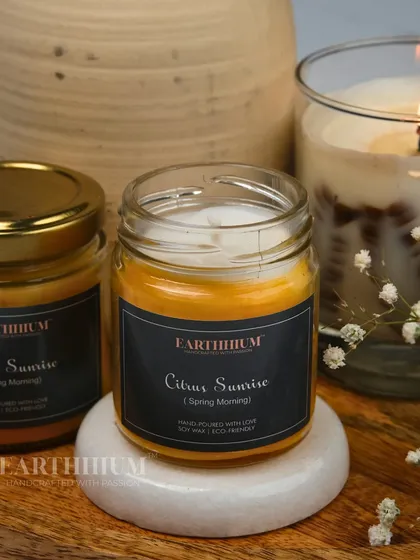 The 'Citrus Sunrise' jar candle is perfect for energizing your mornings with its bright, zesty fragrance.