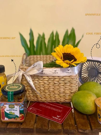 Our "Mango Muse Crate" is the perfect summer gift. This image breaks down the contents: fresh mangoes, mango juice, mango pickle, mango yogurt, and even a mini fan to beat the heat.