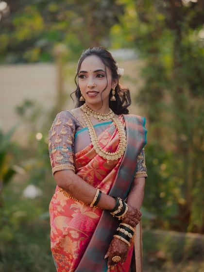A stunning portrait of a Maharashtrian bride on her engagement day. Her elaborate jewelry and the rich colors of her Paithani saree are captured in beautiful natural light.