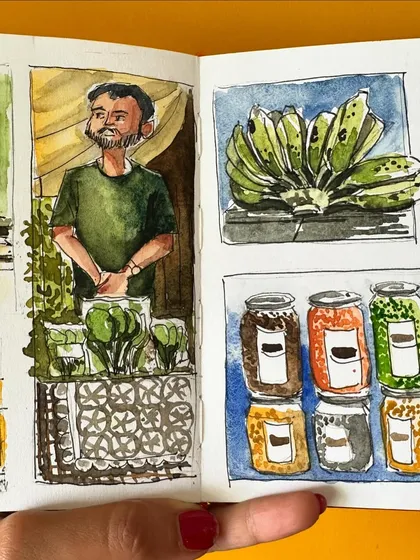 The right side of my farmer's market sketchbook spread, featuring illustrations of fresh bananas, pickles, and a woman singing.