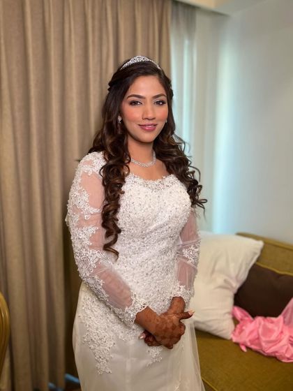 Another angle of the beautiful Christian bride. Her makeup is soft, radiant, and designed to look flawless in person and in photos.