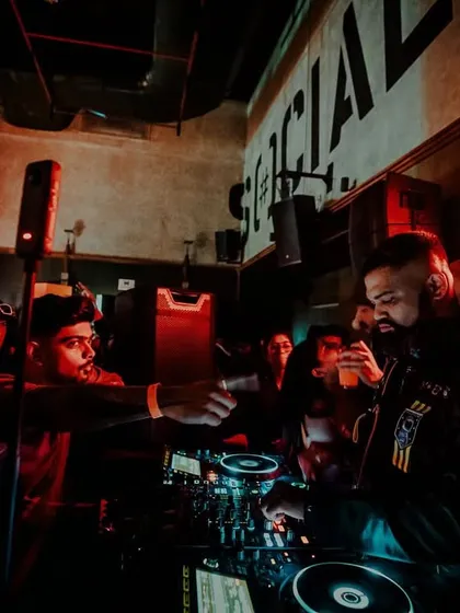 Shaking hands with a fan from the DJ booth. These personal connections are what make the nights special.