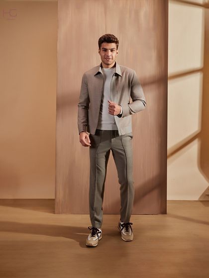 The full look of this neutral winter co-ord set demonstrates its sophisticated and tailored silhouette. It's a versatile choice for creating a chic, minimalist statement.