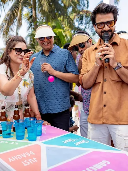 A close-up of a guest concentrating on a beer pong-style game. Even simple games can bring out the competitive spirit and create a lot of laughs.