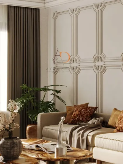 This angle showcases the detailed wall mouldings and heavy drapery that frame the living space, adding a touch of timeless elegance and privacy.
