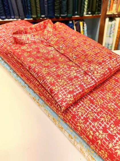A bright red kurta with a gold foil print, perfect for making a statement during the festive season.