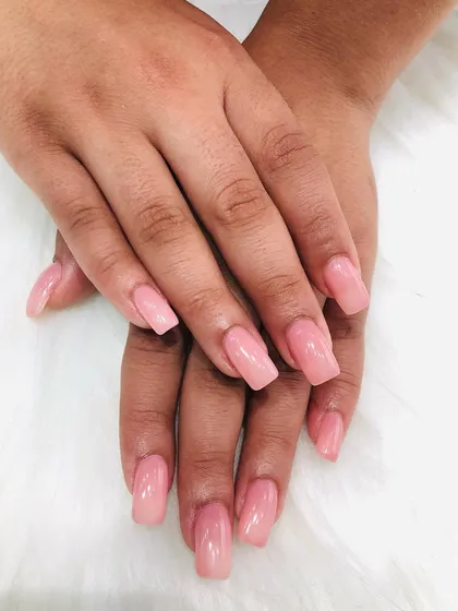 A classic set of square extensions with a semi-sheer pink polish for a natural but polished look.