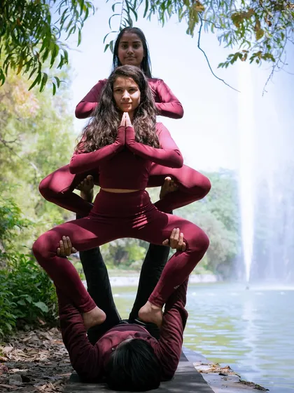 Another angle of the three-person totem, highlighting the strength of the base and the balance of the flyers.