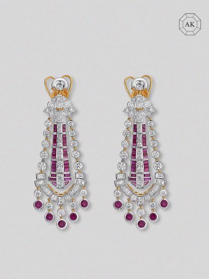 This pair from our Luxury Collection cascades rich African rubies from a mix of round and baguette-shaped diamonds, capturing strength wrapped in elegance.