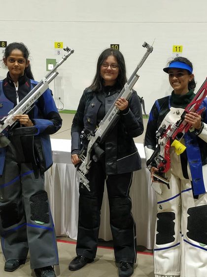 Three of our top female rifle shooters, including Meghana Sajjanar and Natasha Jhaveri, stand ready with their Walther and Feinwerkbau rifles during the state championship.