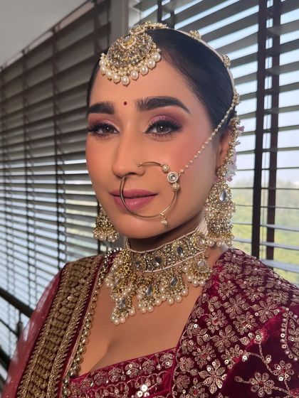 My bride Varda looked stunning. I created a look with dramatic pink-toned eyes and a flawless base, captured here in direct sunlight with no filters.