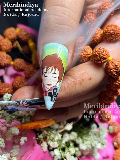 A detailed look at one nail from our Shiv-themed set, featuring a portrait. This demonstrates the fine art skills you can develop for custom nail designs.