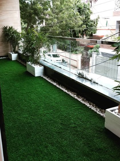 A full view of the long balcony, now a green corridor that feels refreshing and connects the indoor space with the outdoors.