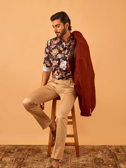 The floral shirt and maroon blazer combination, with the blazer casually slung over the shoulder. This shows the versatility of our statement shirts.