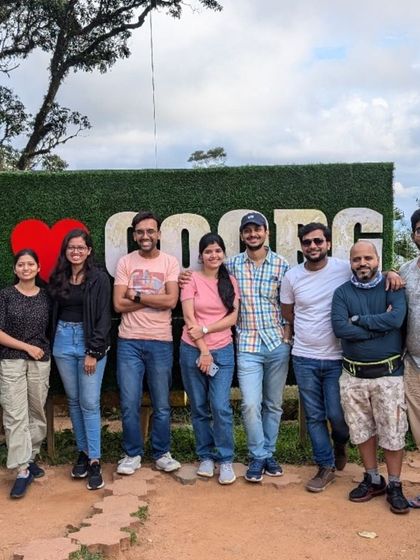 Our tribe showing their love for Coorg! This iconic spot is a must-visit on our trips to the "Scotland of India," perfect for a memorable group picture.