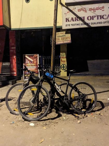 Two bikes parked on a quiet street corner. This was from our first ride back after a break, a simple stack marking our return to the roads.