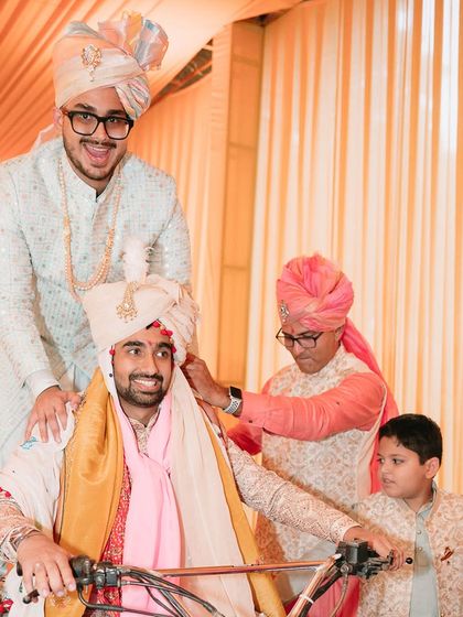 Brothers making a grand entrance on an ATV. This is the freedom of movement our bespoke outfits provide, allowing you to enjoy every moment of the celebration to the fullest.