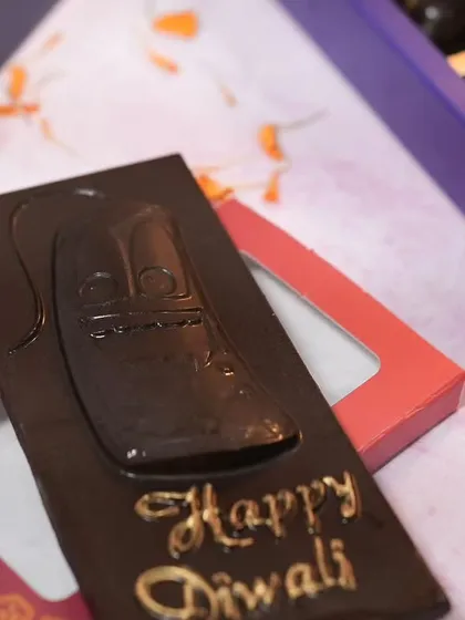 A special treat for the festival of lights. This is my custom "Happy Diwali" chocolate bar, available in crunchy, roasted almond, and fruit and nut flavors. It's a simple, sweet, and affordable festive gift.