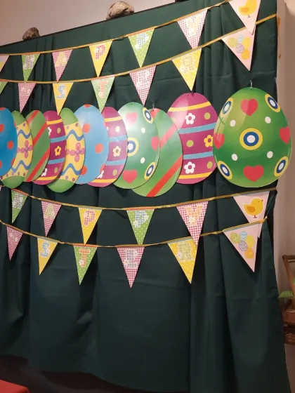 A festive backdrop of Easter eggs and bunting, perfect for photos and creating happy memories.
