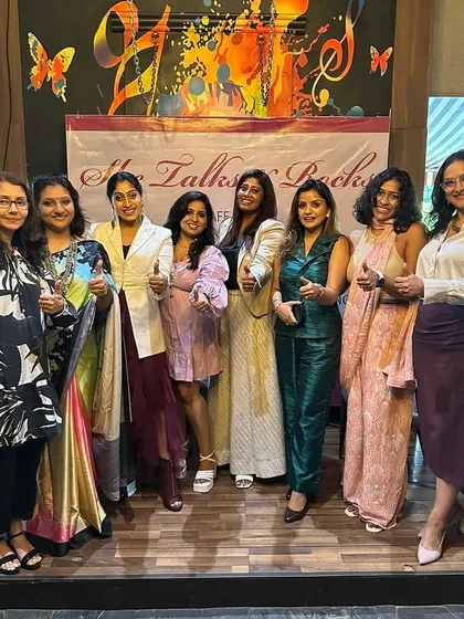 Nobody cares about your story until you win. So, win. Posing with other inspiring women at a networking event, feeling motivated and empowered.