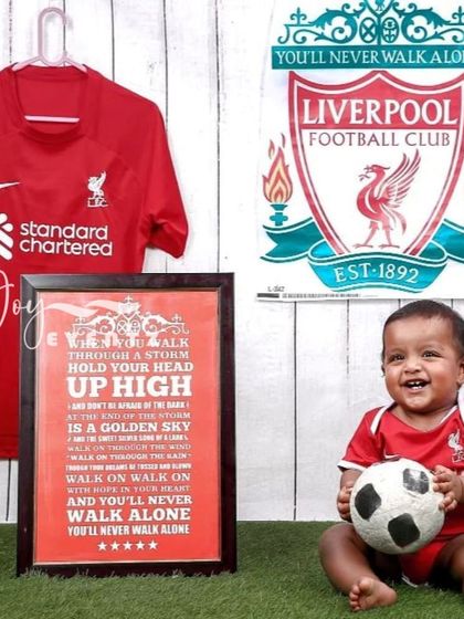 For the future football star, we offer a Liverpool FC themed photoshoot. We create an authentic Anfield atmosphere with the team jersey, crest, and a football, perfect for capturing your little fan's passion.