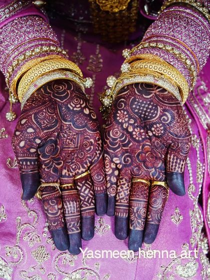 Afra's final bridal look. The deep, dark stain on her hands looks absolutely regal with her purple and gold outfit.