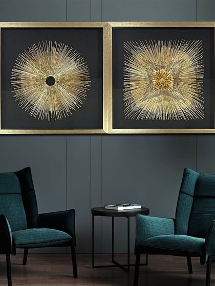 The Sunflare Elegance shadow box is a remarkable piece for any living space. This set of two features intricate golden sunburst designs against a black background, radiating warmth and modern charm.