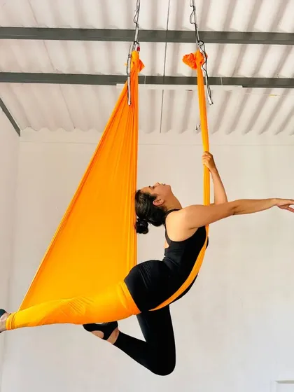 Discover the freedom of flight in our Aerial Yoga classes. This beautiful pose combines grace, strength, and flexibility, allowing you to explore movement in a completely new way.