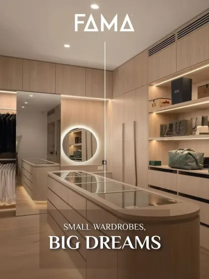 This image is identical to 48 and showcases a compact yet highly effective wardrobe design. The use of light wood and a glass-topped island creates a sense of openness, making it a perfect solution for smaller rooms.