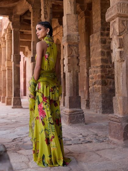 The back view of the lime green floral ensemble, showing the beautiful drape of the ruffled jacket.