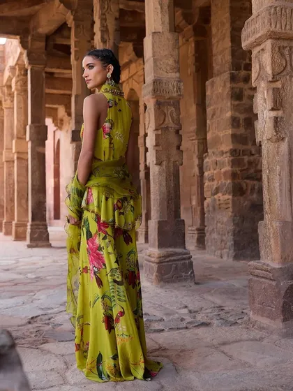 The back view of the lime green floral ensemble, showing the beautiful drape of the ruffled jacket.