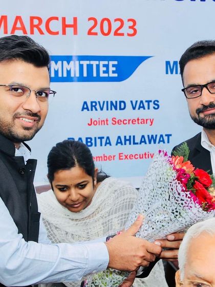 Presenting a bouquet to a guest at the farewell function. It is our tradition to honor those who have served our judicial system.