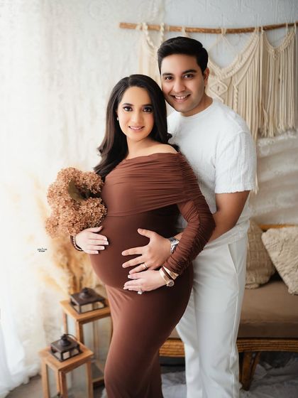 A classic portrait in our earthy-toned setup. The couple looks directly at the camera, their loving embrace and the warm background creating a beautiful and welcoming image.