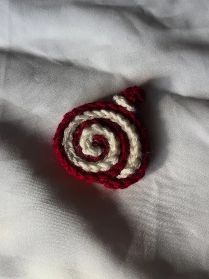 A close-up of the red and white crochet cake roll. This one reminds me of red velvet cake.